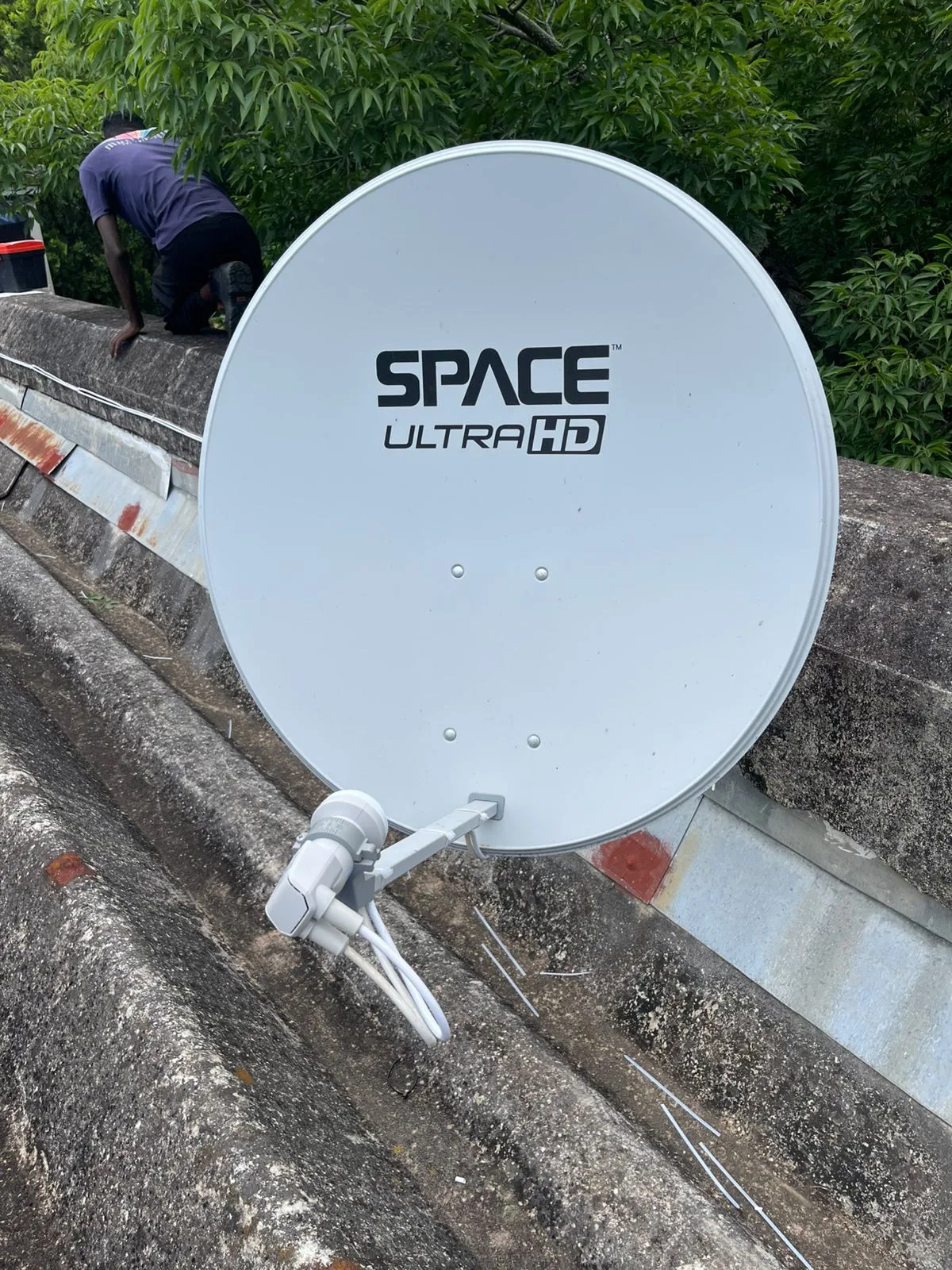 DSTV Space Ultra HD satellite dish installed on a tiled suburban roof